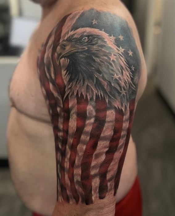 Bald eagle and American flag on the shoulder